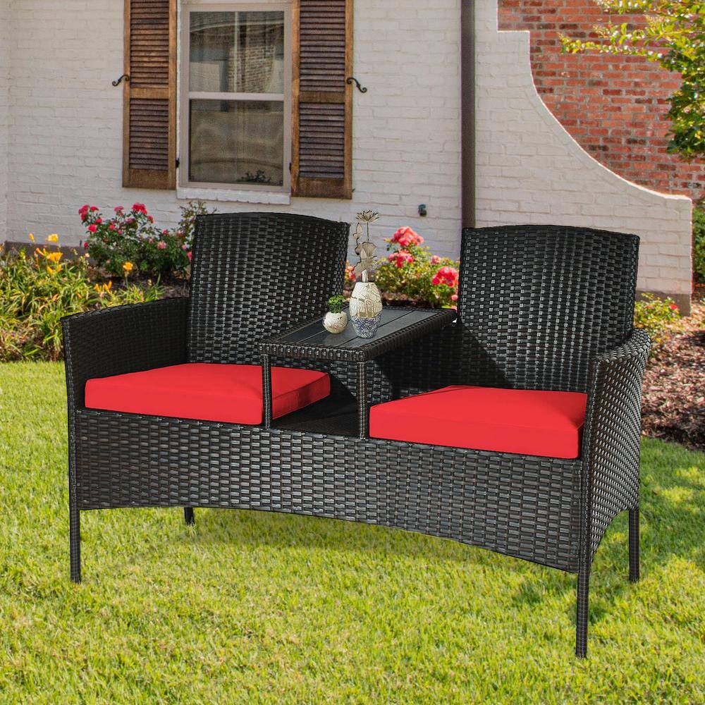 Compact Black Wicker Patio Loveseat with Red Cushions and Glass Table