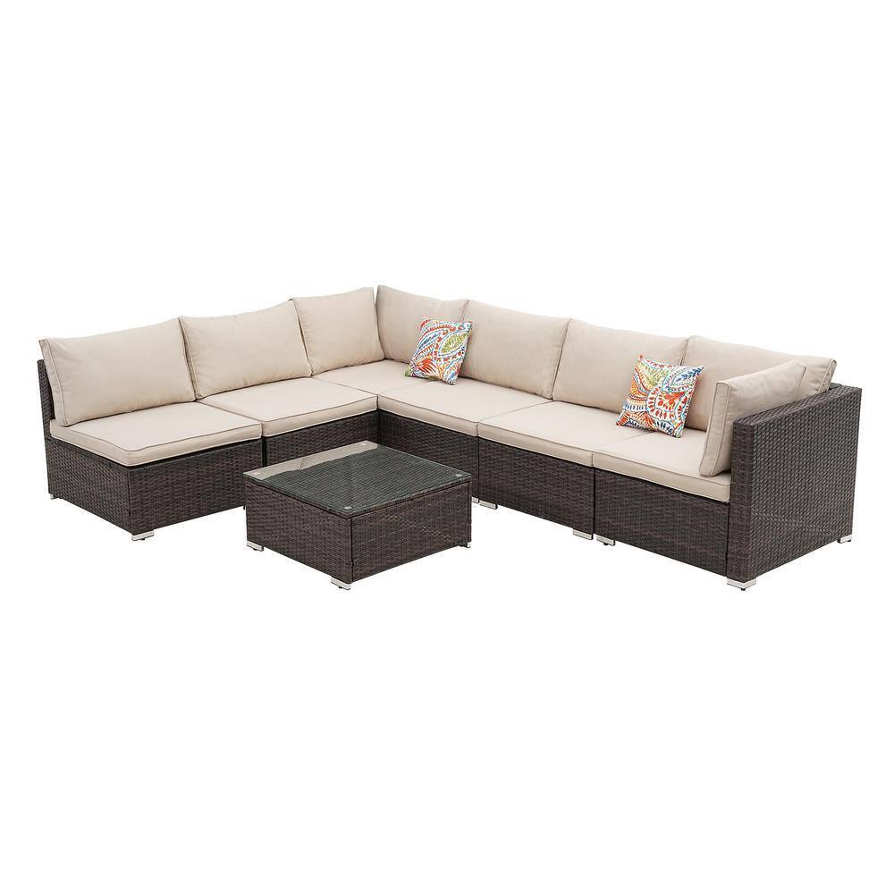 7-piece brown wicker outdoor sectional set with beige cushions and a coffee table.