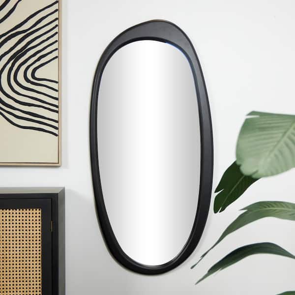Litton Lane 51 in. W x 24 in. H Abstract Oval Asymmetrical Frameless Black Wall Mirror