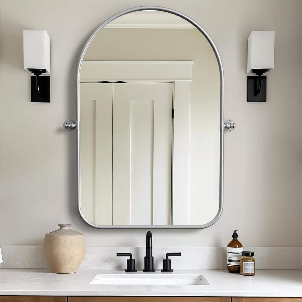 24 in. W x 35 in. H Arched Metal Framed Pivoted Bathroom Wall Vanity Mirror