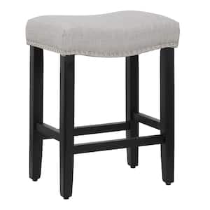 Jameson 24 in. Counter Height Black Wood Backless Nailhead Trim Barstool with Upholstered Gray Linen Saddle Seat