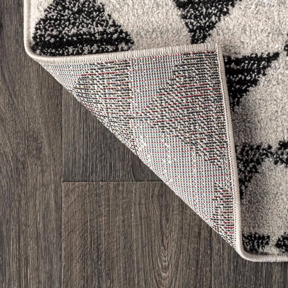 Aisha Cream and Black Geometric 10' x 14' Synthetic Area Rug