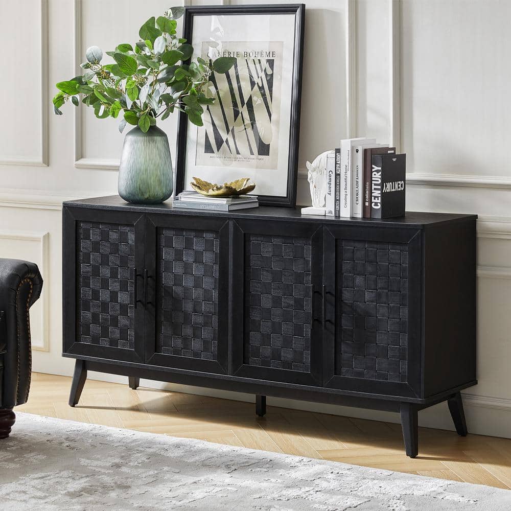 Black modern wood sideboard with woven doors in a styled room.