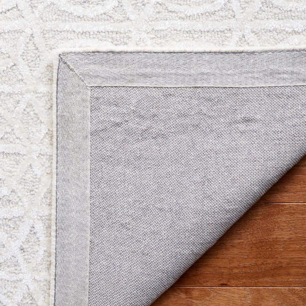 Beige and Ivory Tufted Wool and Viscose 6' x 9' Area Rug