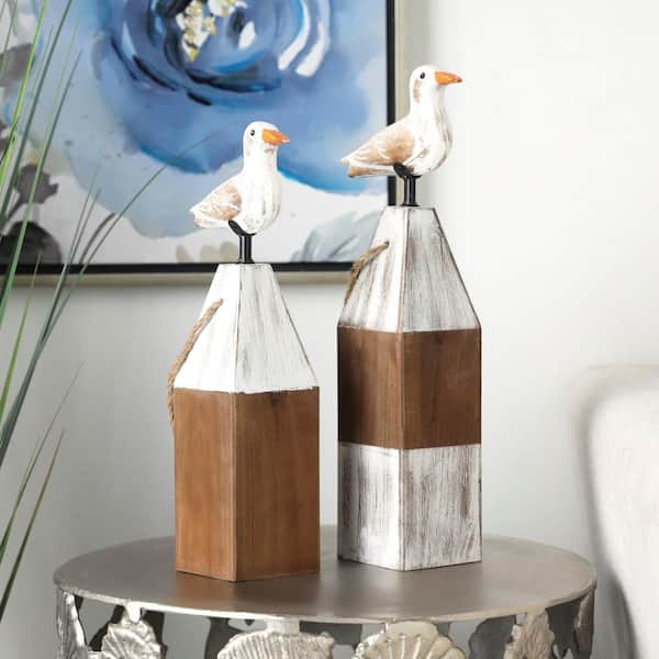 Litton Lane Brown Wooden Bird Sculpture with White Distressed Buoy Posts (Set of 2)