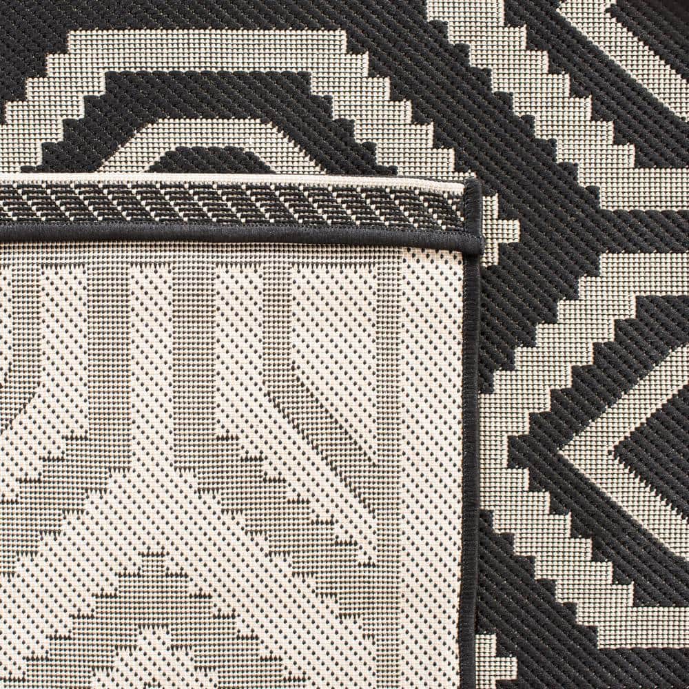 Rectangular Black and Beige 5' x 7' Wool Blend Area Rug