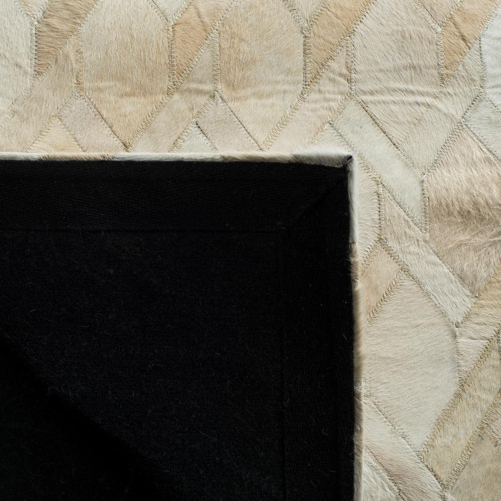 Ivory Geometric Handmade Wool and Cowhide Area Rug