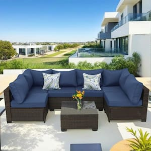 Brown 7-Piece Wicker Outdoor Sectional Set with Glass Table and Dark Blue Cushions