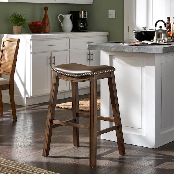 HomeSullivan 30.2 in. Brown Faux Leather Saddle Seat Backless Wood Frame Bar Height Stool
