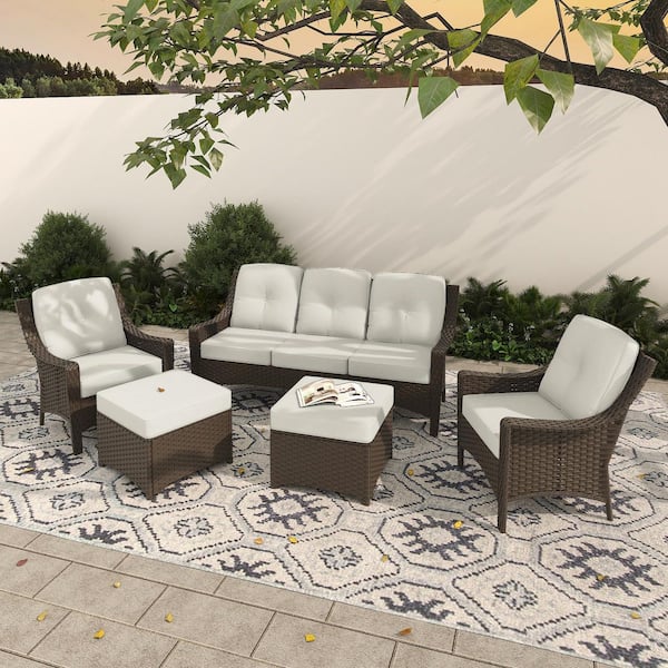 5-Piece Wicker Patio Furniture Set with Beige Cushions, 3-Seater Sofa, Armchairs, and Ottomans