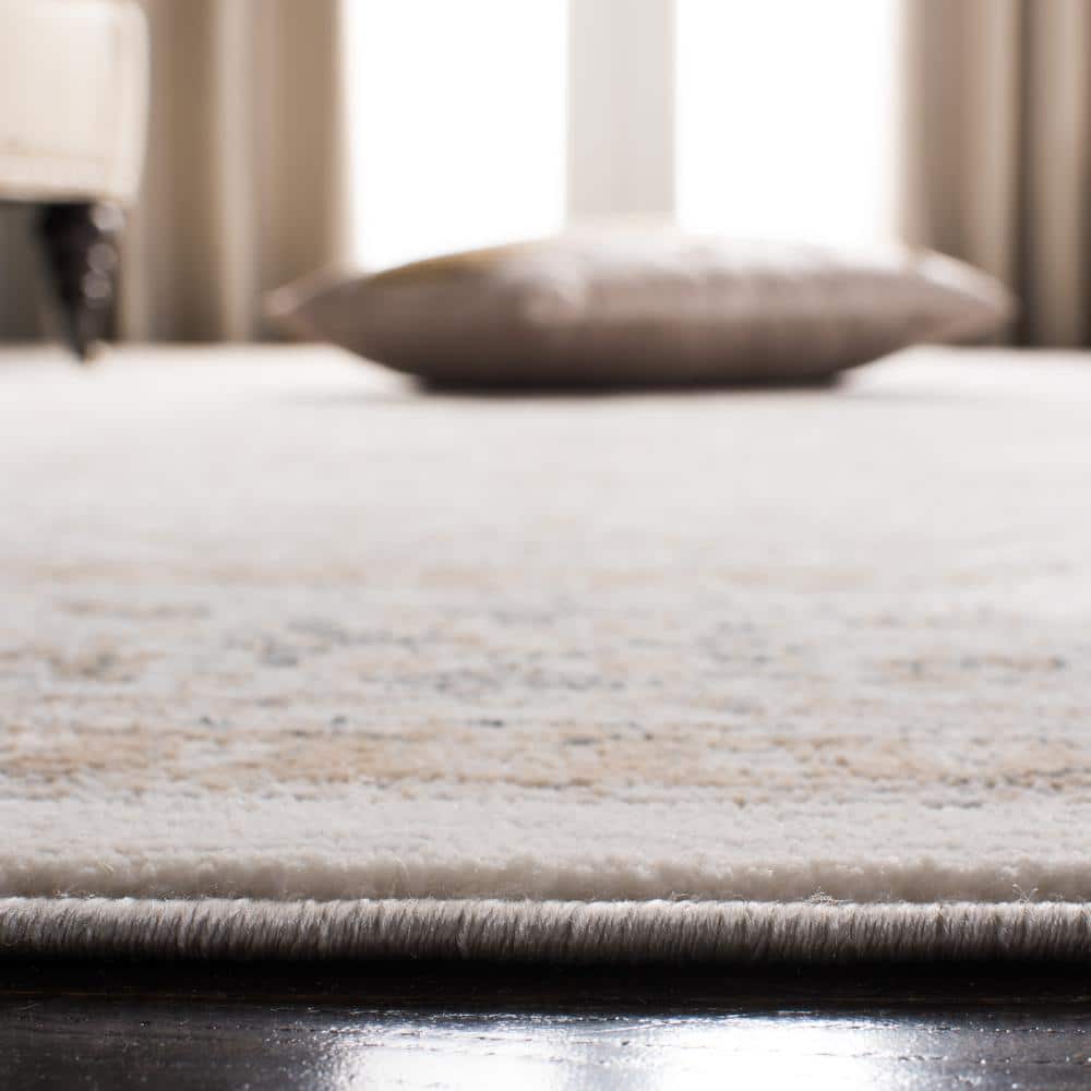 Isabella Blue and Cream 9' x 12' Synthetic Oriental Area Rug