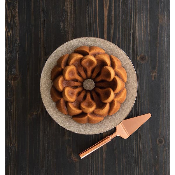 https://images.thdstatic.com/productImages/8a658ae9-c5a6-42e6-a73f-904ab652a438/svn/brown-nordic-ware-fluted-tube-cake-pans-93848m-1f_600.jpg
