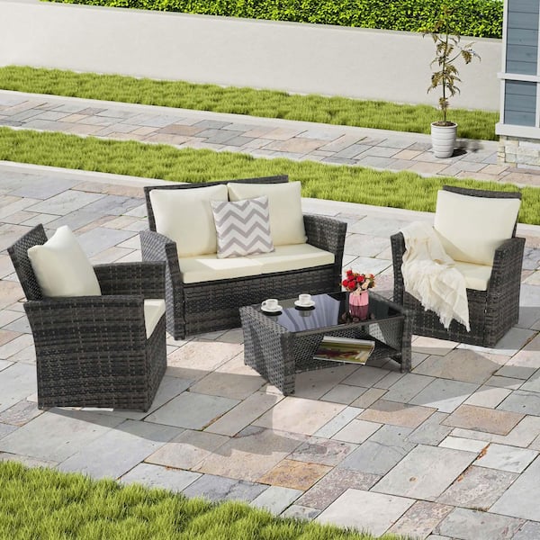 Zeus & Ruta 4-Piece Gray Wicker Outdoor Patio Conversation Set with Beige Cushions and Tempered Glass Coffee Table