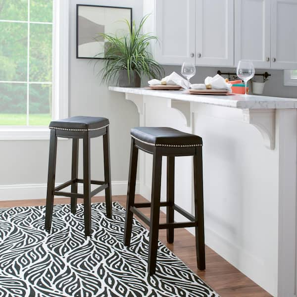 black cushioned bar stools