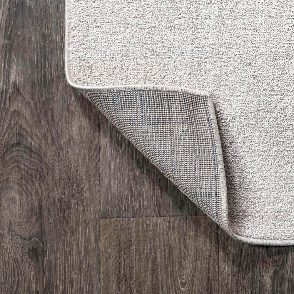 Ivory Solid Synthetic 10' x 14' Reversible Area Rug
