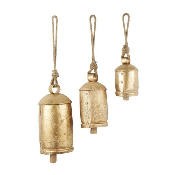 Litton Lane Gold Metal Tibetan Inspired Cylindrical Decorative Cow