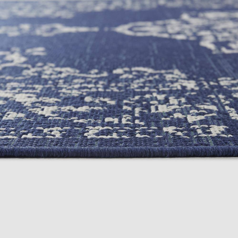 Blue and White Synthetic Oriental 8' x 10' Area Rug
