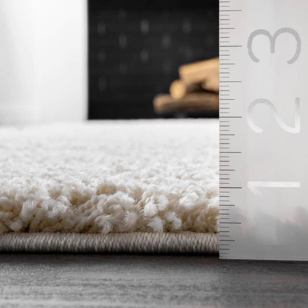 Cream and Beige Synthetic Shag Area Rug, 9' 2" x 12'