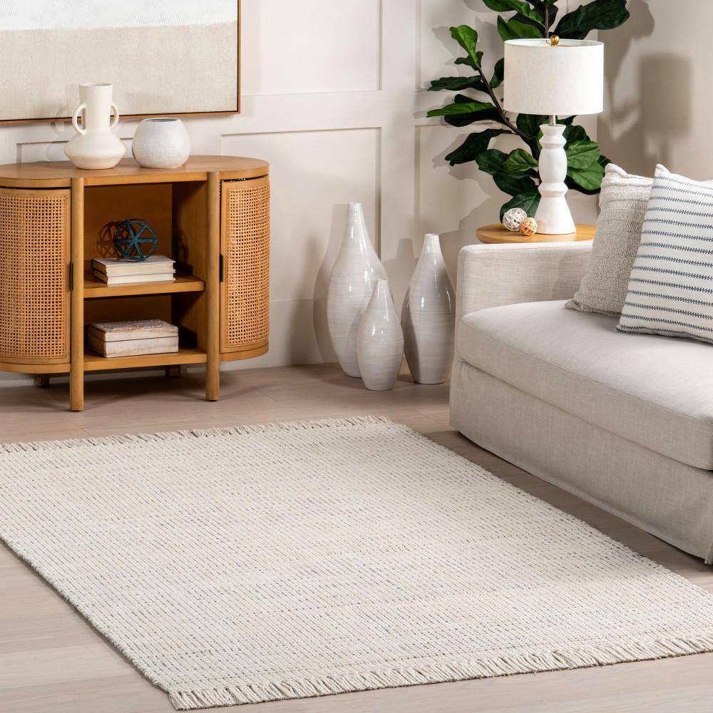 Handmade Ivory Wool Rectangular Area Rug with Fringe