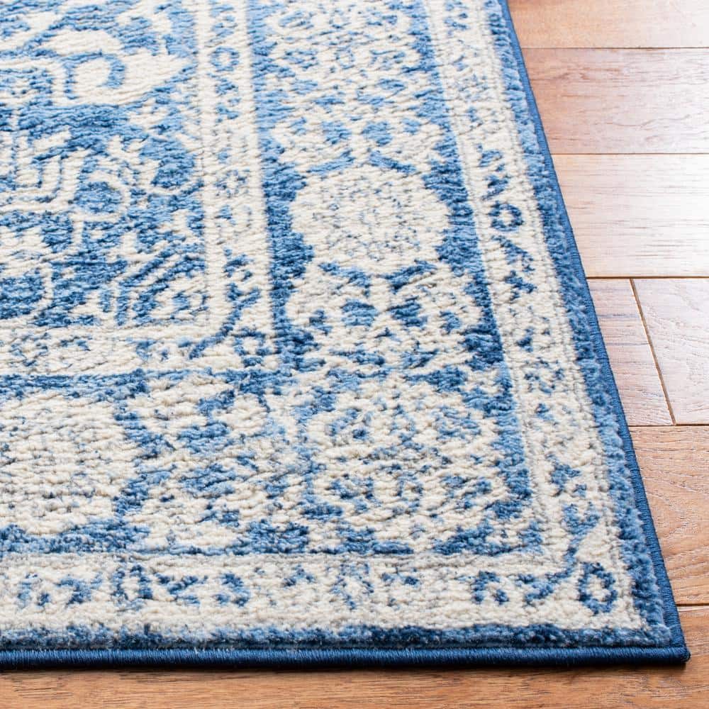 Ivory and Navy 8' x 10' Synthetic Washable Reversible Area Rug