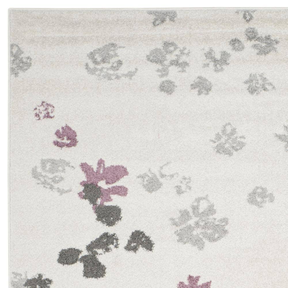 Ivory and Purple Floral Synthetic 8' x 10' Area Rug
