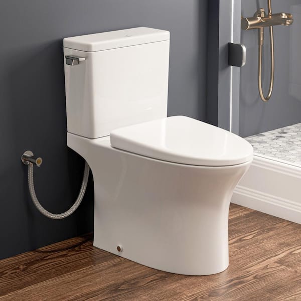 MaceratingFlo Rear Outlet Toilet 2-Piece with White Elongated Bowl, 7 in. Rough-In, 1.28 GPF Single Flush, Includes 2 Extension Pipes