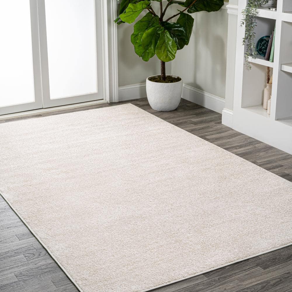 Ivory Solid Synthetic 10' x 14' Reversible Area Rug
