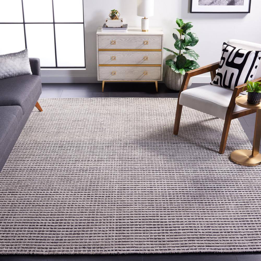 Handmade Black and Ivory Abstract Wool Area Rug, 5' x 8'