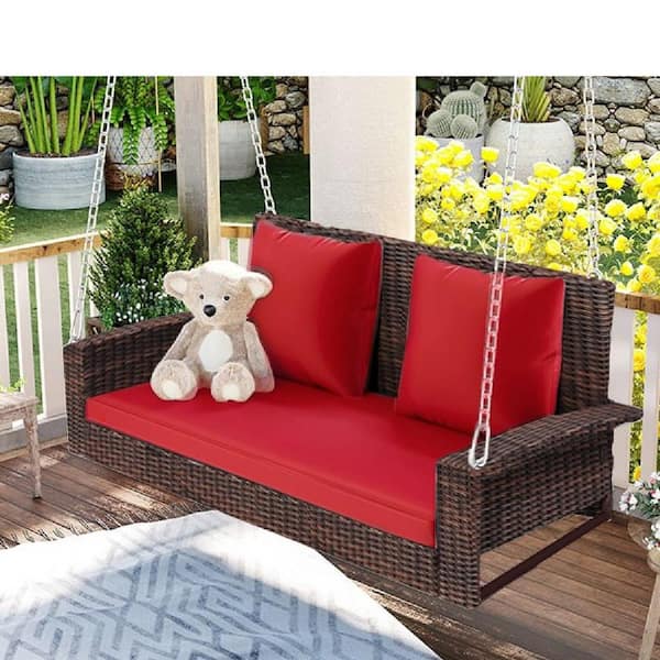 Runesay 50 in. W 2-Person Wicker Hanging Porch Swing with Chains Red Cushion Pillow Rattan Swing Bench for Garden Backyard Pond
