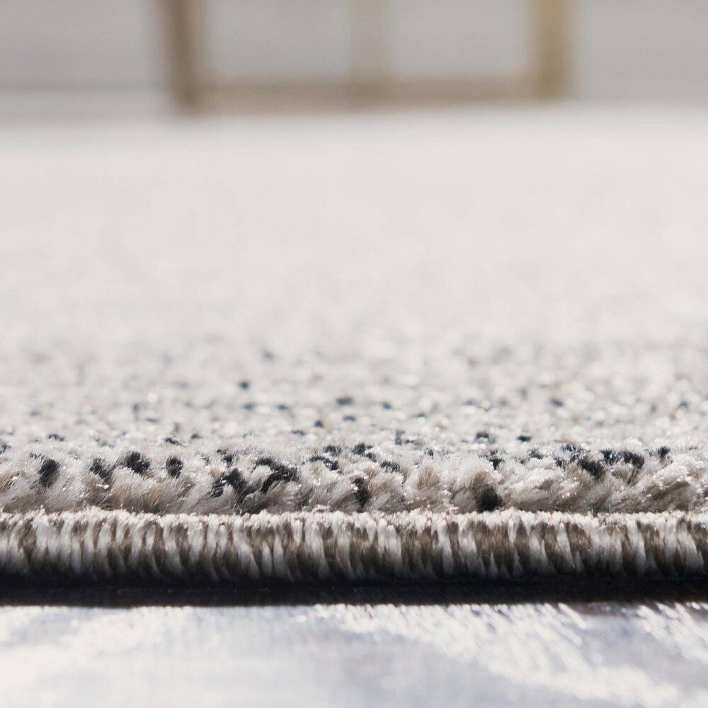 Light Gray 9' x 12' Easy Care Tufted Synthetic Rug
