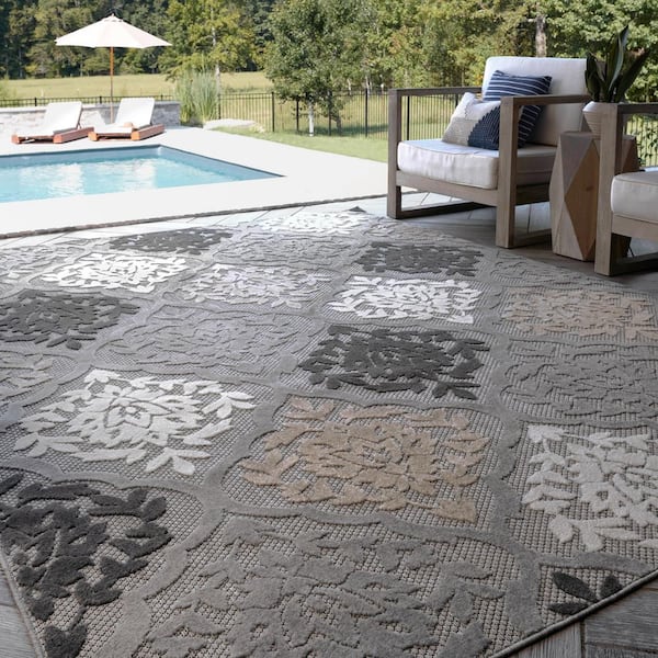 https://images.thdstatic.com/productImages/8c13cfef-1ce1-44b2-9a9b-1f6003a69e43/svn/gray-tayse-rugs-outdoor-rugs-oas1209-5x7-31_600.jpg