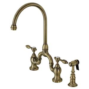 Tudor Double-Handle Deck Mount Gooseneck Bridge Kitchen Faucet with Brass Sprayer in Antique Brass
