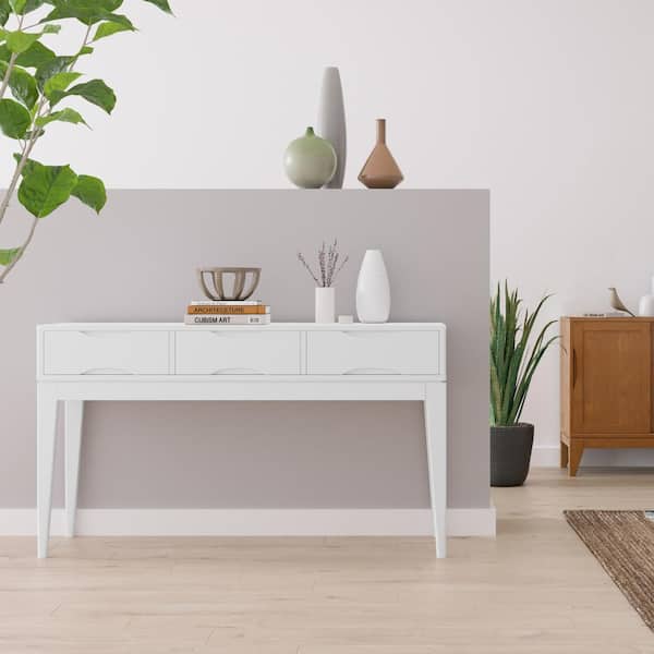 https://images.thdstatic.com/productImages/8c600b7b-6468-511c-8a36-258f538f16bd/svn/white-simpli-home-console-tables-axchrp-03wh-31_600.jpg