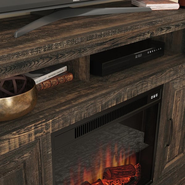 https://images.thdstatic.com/productImages/8c7e6166-fda1-4971-a205-1e9b85ae111e/svn/carbon-oak-sauder-fireplace-tv-stands-427378-1f_600.jpg