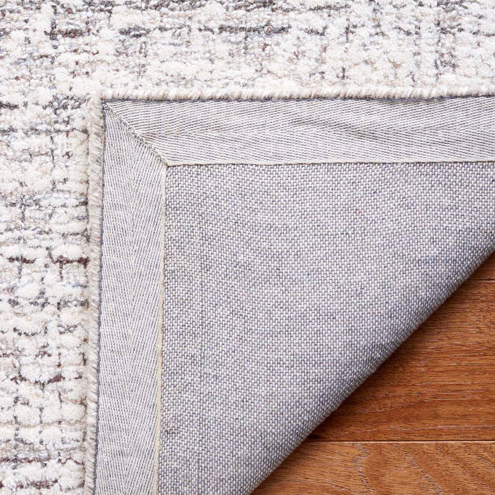 Ebony 6' x 9' Brown and Ivory Wool Tufted Area Rug