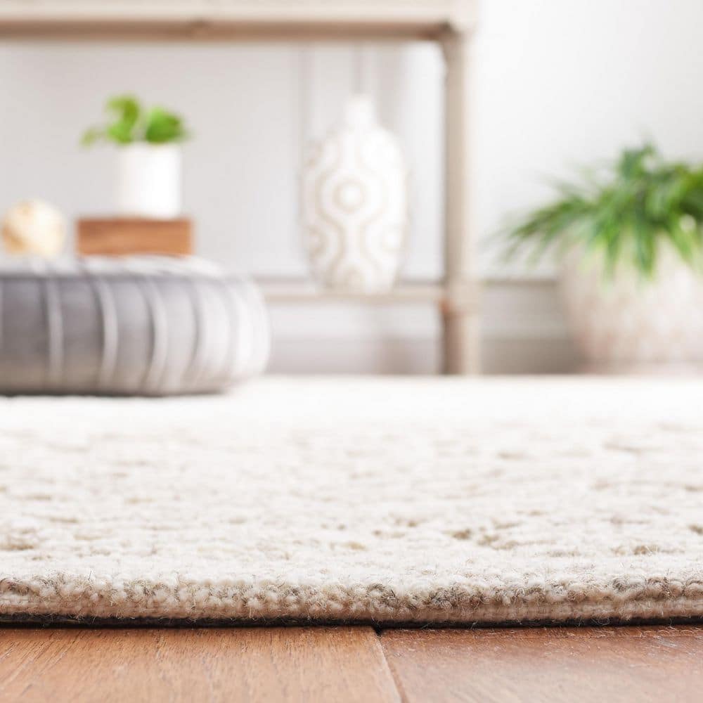 Ivory and Natural 4' x 6' Hand Tufted Wool Area Rug