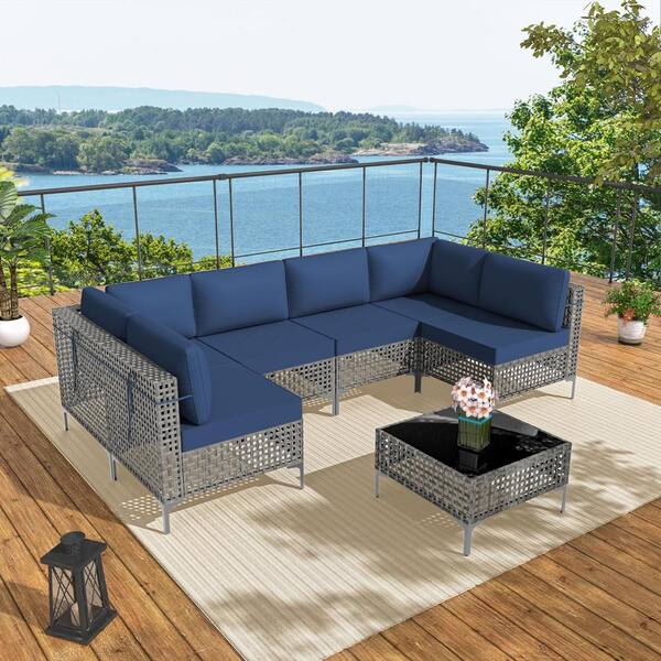 Halmuz 7-Piece Gray Wicker Outdoor Furniture Sectional Set, with Glass Coffee Table and Navy Cushions