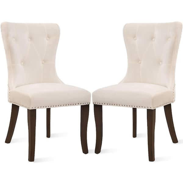 cream tufted chairs