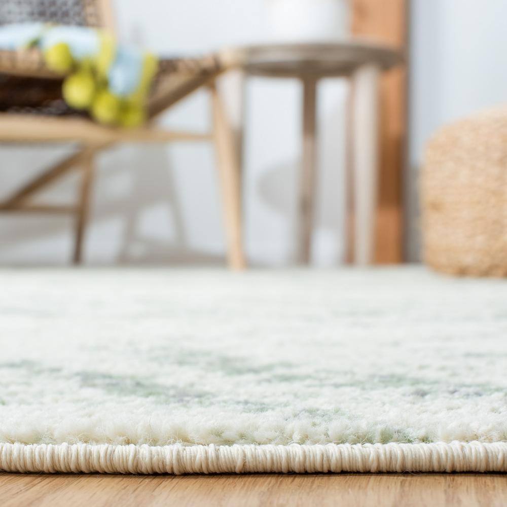 Ivory and Green Geometric 10' x 14' Synthetic Area Rug