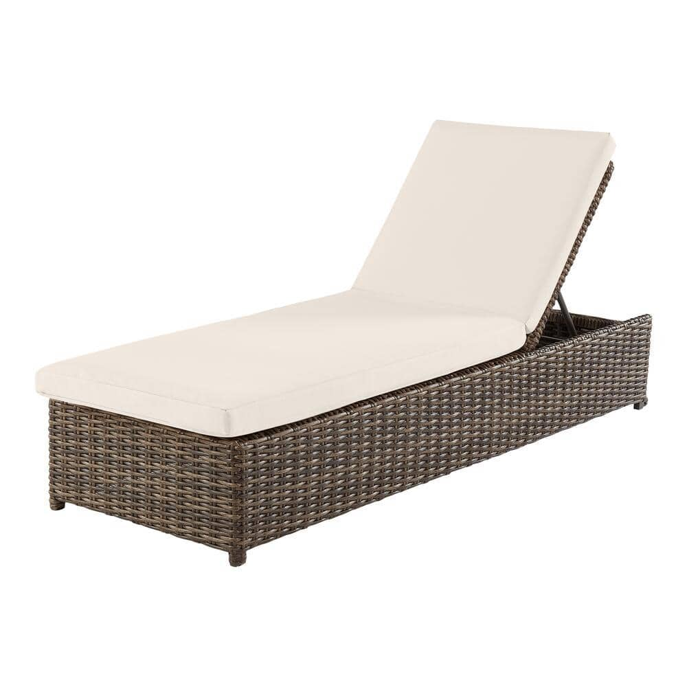 tan wicker chaise lounge