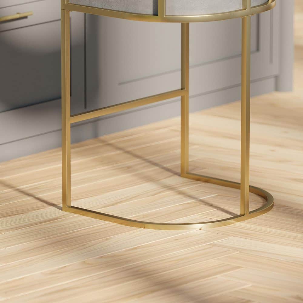 Close-up of the gold metal base of a bar stool.