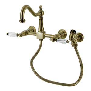 Wilshire 2-Handle Wall Mount Kitchen Faucets with Brass Sprayer in Antique Brass