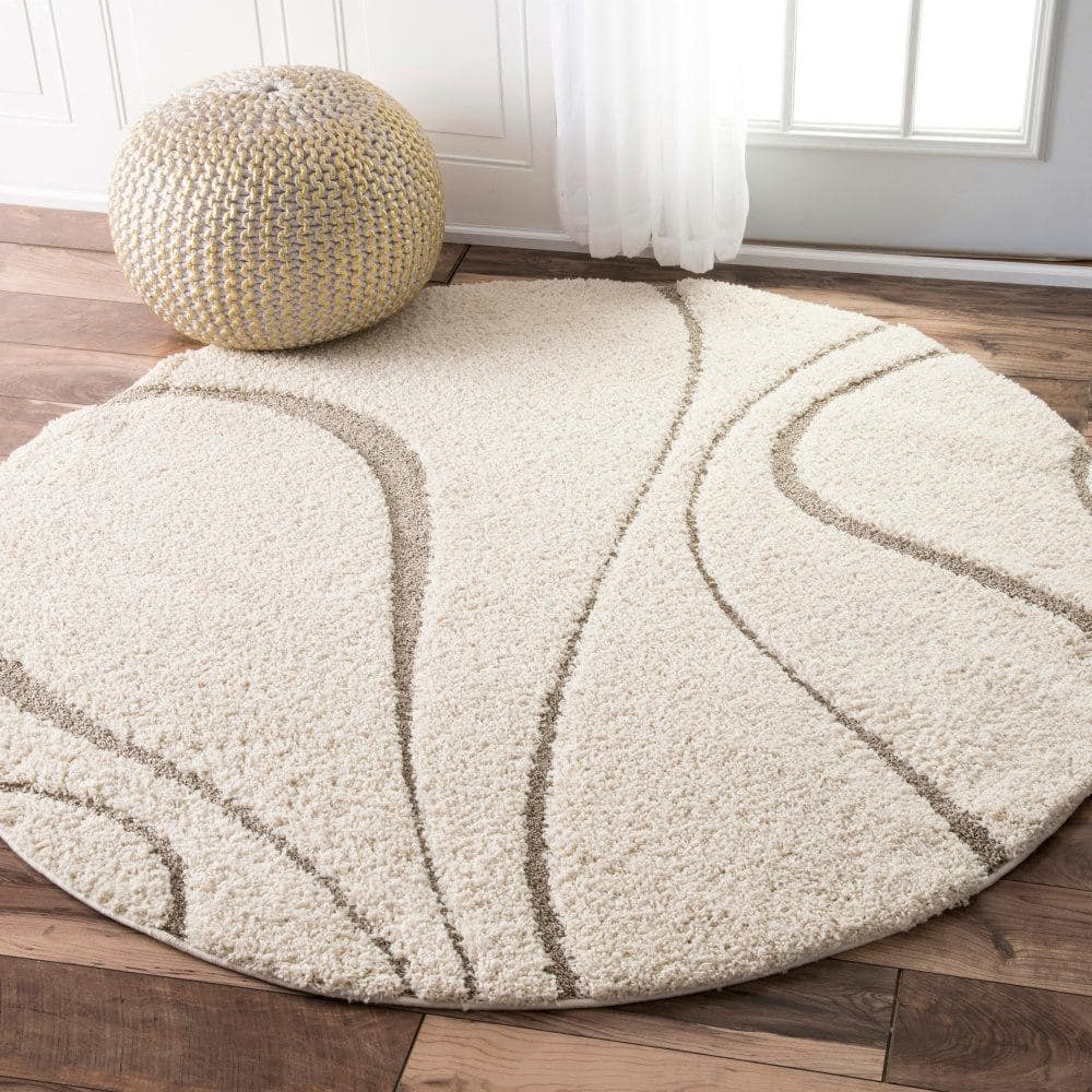 Carolyn Off-White Synthetic Tufted Shag Round Rug, 7' 10"