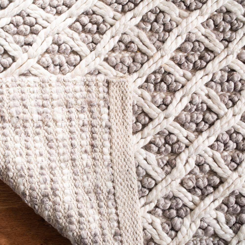 Ivory and Beige Braided Wool Area Rug, 5' x 8'