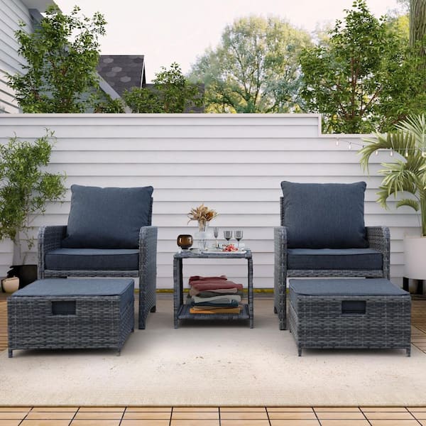 5-Piece Wicker Outdoor Conversation Set with Dark Blue Cushions Ottomans and Coffee Table for Poolside Garden