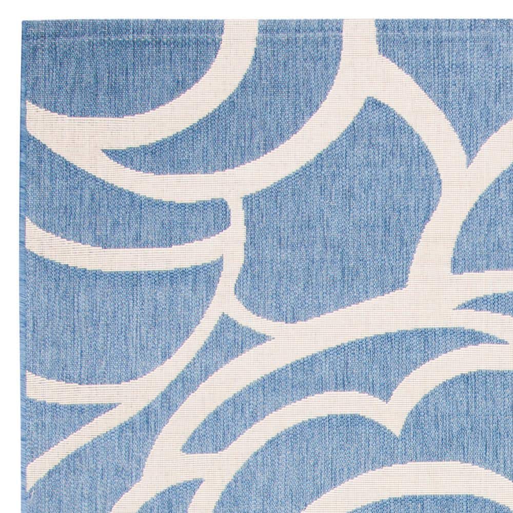 Reversible Blue/Beige Synthetic 9' x 12' Easy-Care Area Rug