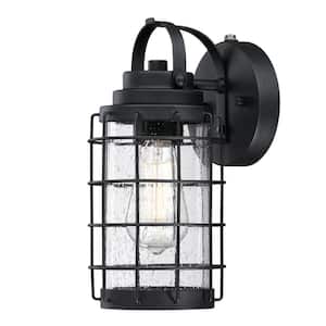 Jupiter Point 1-Light Textured Black Finish Outdoor Wall Mount Lantern with Clear Seeded Glass, Dusk to Dawn Sensor