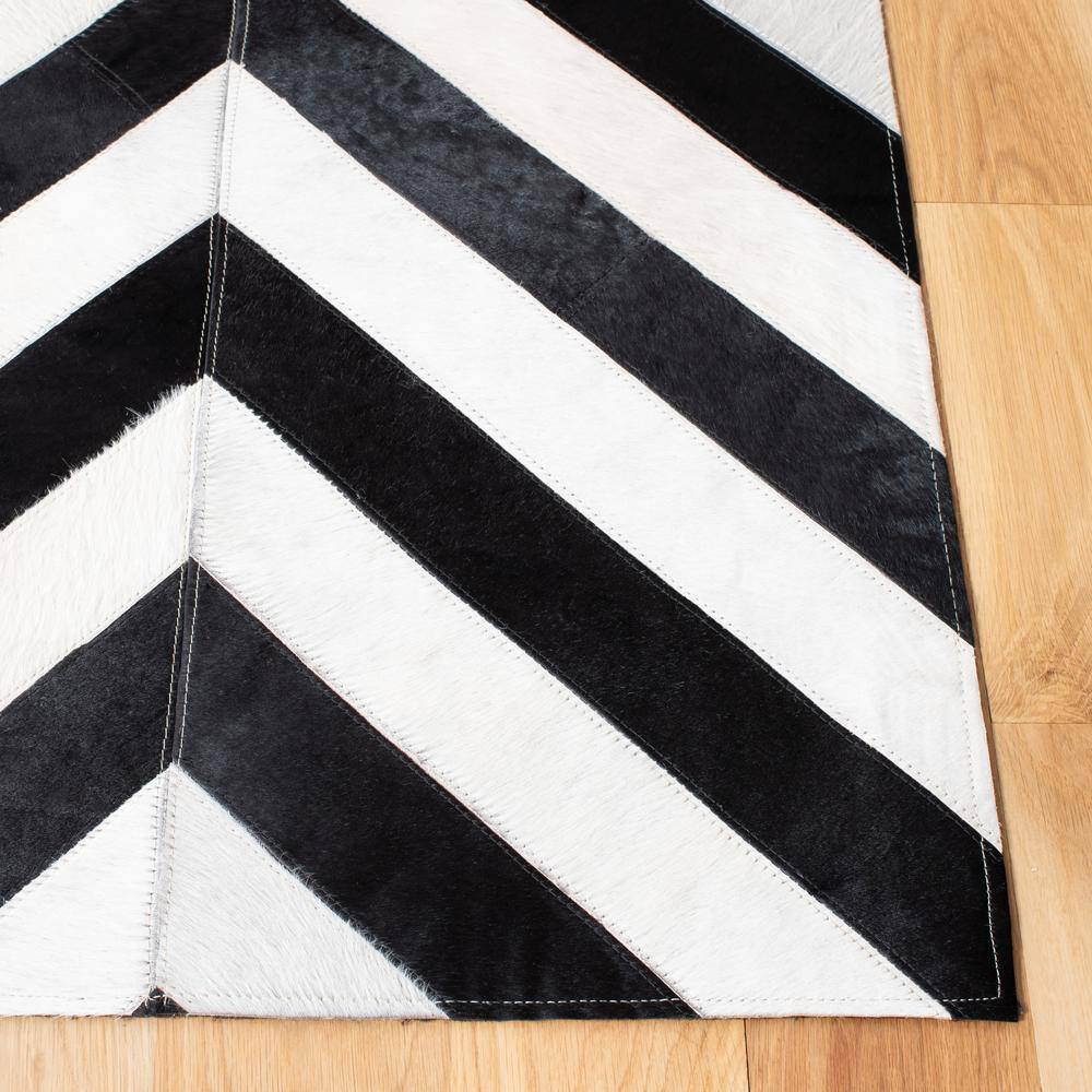 Hand-Knotted Geometric Black and White Cowhide Area Rug 5' x 8'