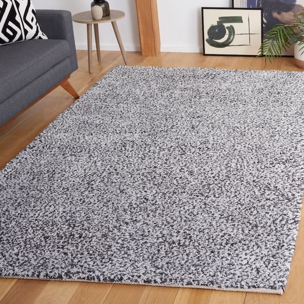Berber 6 ft. x 9 ft. Ivory/Black Abstract Speckled Area Rug