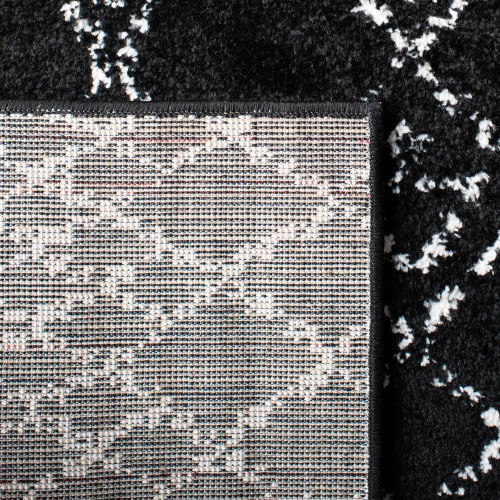 Boho-Chic Black/Ivory Synthetic 6' x 9' Hand-Knotted Area Rug
